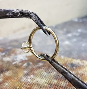 Positioning a ring to be soldered